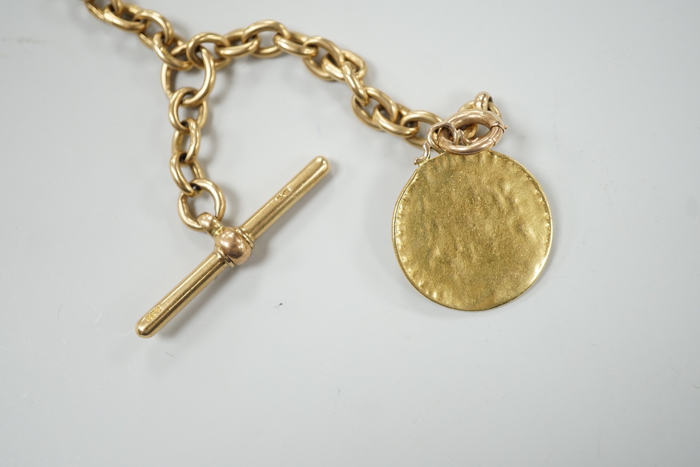 An early 20th century 18ct gold albert, 44cm, hung with a gold coin (worn), chain 53 grams, coin and bale, 9 grams.